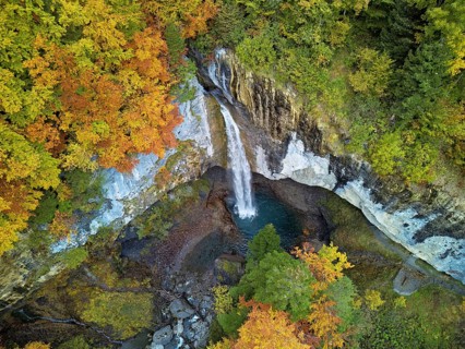 Aerial view of Berglistüber waterfall in autumn-colored surroundings, Linthal, Klausenpass, Canton