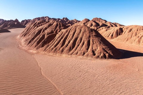 Scenic view of the Devil's Desert in Salta, Argentina, showcasing striking red rock formations