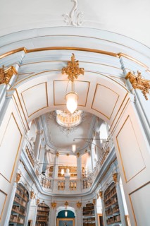 Elegant library architecture with elaborate ceiling and pendant lighting, Weimar, Germany