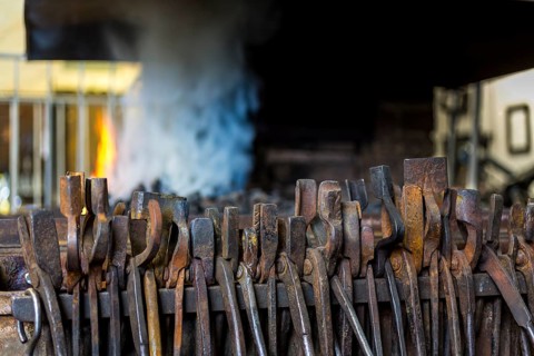 A blacksmith forging, working at the Ehnert forge in Dresden-Bühlau, Saxony, Germany