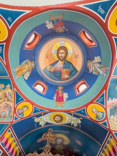 Ceiling painting with Christian Greek Orthodox motifs Jesus Christ in small church chapel in
