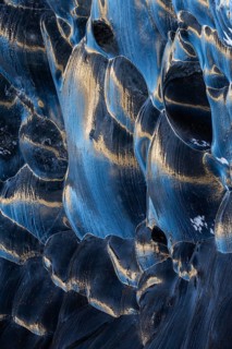 Structures in glacial ice, ice cave, glaciers, black glaciers reflecting sunlight, Vatnajökull,