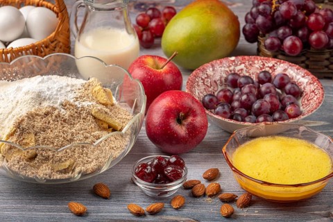 Bowl with baking ingredients in addition to eggs, milk and fruit