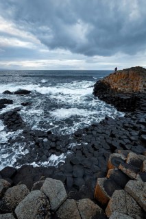 Rocky coast with black basalt columns, coastline, dusk by the sea, Giant's Causeway, Giants