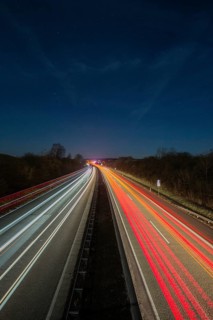 A7 Motorway, Autobahn, beside Kassel at night with light trails from the traffic headlights and