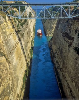 Ship passes the narrow Corinth Canal surrounded by high cliffs, Corinth Canal, Corinth,