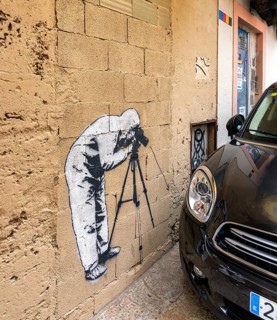 Artistic graffiti on a house wall in Carrer de Sant Pere, Palma de Majorca, Spain