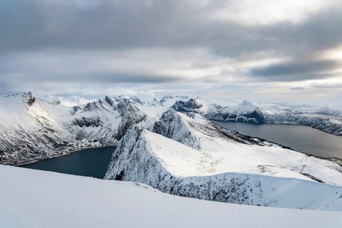View of the snow-capped mountains of Senja Island, Troms, Norway