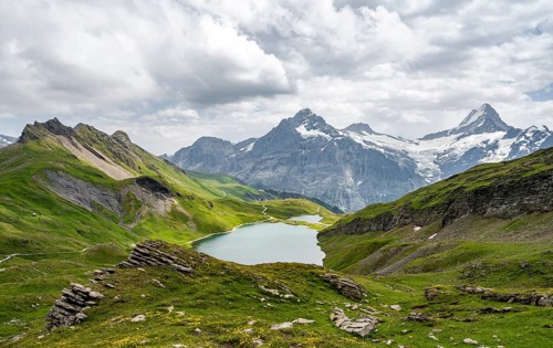 Mountain landscape with Bachalpsee mountain lake, Mittelhorn peaks and Schreckhorn with upper