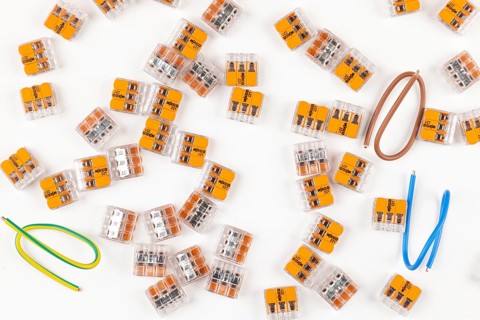 Numerous connection clips in different colors on a white background
