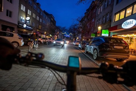 Cycling in the city, in the dark, in the evening, inner-city road, bicycle road, two-wheeler