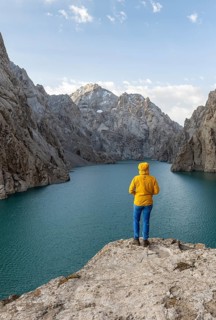 Hiker in front of Kol Suu Mountain Lake, Kol Suu Lake, Sary Beles Mountains, Naryn Province,