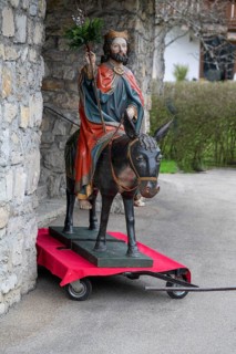 Palm donkey in front of St Jodokus Church, ready for the procession, Bad Oberdorf, Oberallgäu,