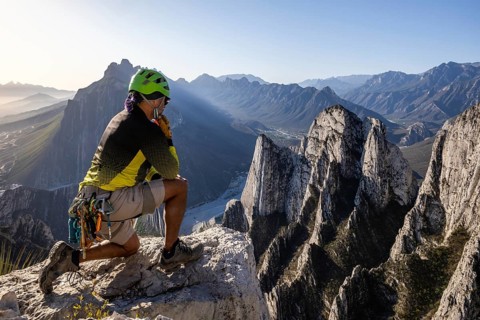 A man pauses atop Eagle's Nest, Monterrey, Mexico, after practicing mountaineering and rappelling.