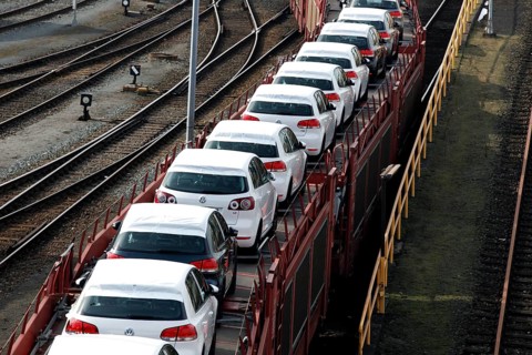 Wolfsburg, DEU, 250211 - Car transport wagons with new Volkswagen Golf and Tiguan vehicles on the