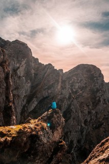 A hiker at the top of the mountain of Aiako Harria or Peñas de Aya in the town of Oiartzun,