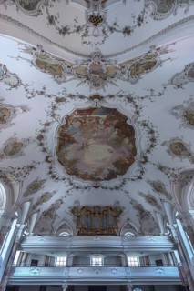 Organ loft and ceiling paintings in the baroque church of St. Andrew, Nesselwang, Bavaria, Germany