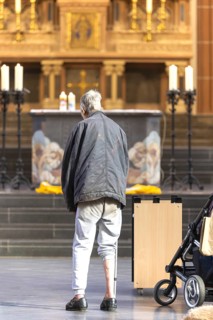 A mentally confused homeless man in the church, family mass with blessing of animals in St Agnes,