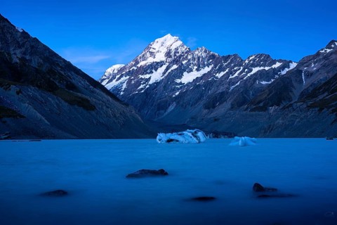 Mountainous landscape. Hooker Lake and Aoraki Mount Cook. Evening mood, blue hour. Aoraki Mount