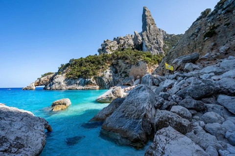 Light blue clear sea on a dream beach on Cala Goloritzé, picturesque rocky coast, steep coast with