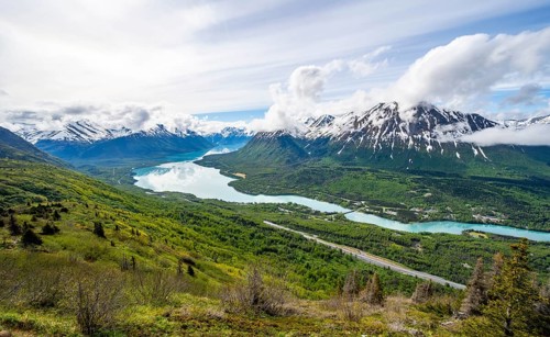 View of snowy mountains in spring and turquoise blue Kenai Lake, Slaughter Ridge Trail, Cooper