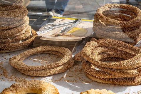 Traditional sesame seed bagels known as koulouria in Greek are a popular street food snack sold