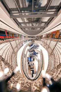 Interior view of a brightly lit shopping centre with glass dome, Königsbau Passage, Stuttgart,