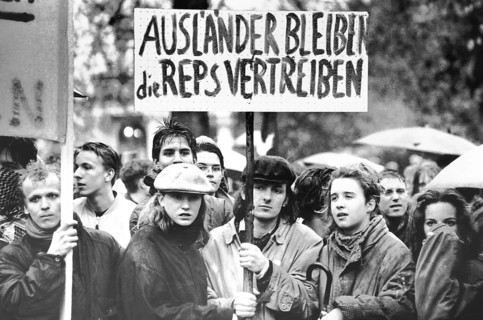 Staying foreigners driving away reps is on a poster that is shown by demonstrators in front of