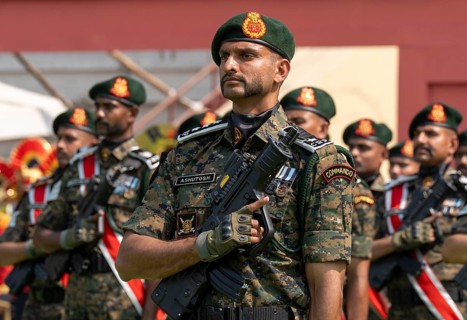 Central Reserve Police Force (CRPF) personnel wearing ceremonial headgear stand in formation during