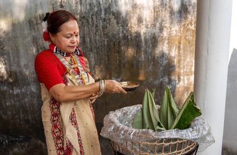 A Mising woman prepares traditional rice beer 'Aapong' during Ali-Aye-Ligang festival in Guwahati,