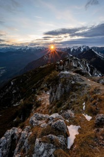 Mountain panorama, mountain landscape with sun star at sunset, at the summit of the Kramerspitz, in