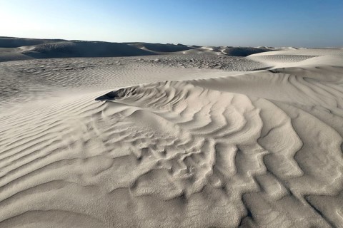White sand dunes in the Khaluf Desert, Oman