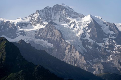 Glaciated Jungfrau mountain peak, picturesque mountain landscape, Bernese Alps, Bernese Oberland,