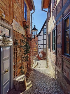 Narrow, romantic passageway with half-timbered houses on the Schlossberg, Old Town of the World