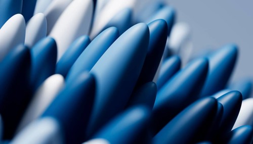A close-up view of elegant blue abstract 3D rendered conical shapes with a soft, smooth surface and