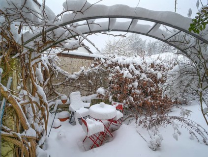 Snowy seating in a garden, Eckental, Middle Franconia, Bavaria, Germany