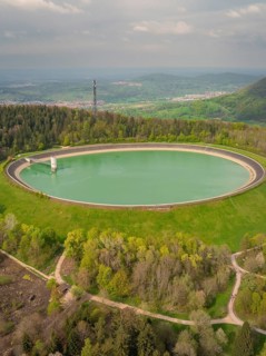 Upper reservoir, large round reservoir in wooded landscape with wide views, Glems reservoir,