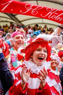 Colourfully costumed carnivalists celebrate carnival in Cologne, on Weiberfastnacht the street