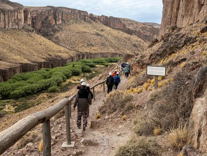 Guided tourist group visiting the Cueva de las Manos, Unesco World Heritage, prehistoric paintings,
