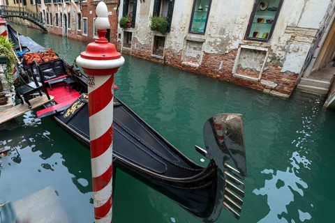 Gondola at the pier in the old town, Venice, Veneto, Italy