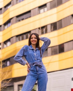 Young caucasian girl with a monkey cowboy in a yellow and black house. Enjoying the city on