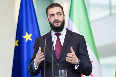 Ahmed al-Sharaa (President of the Syrian Arab Republic) at a joint press conference with Friedrich
