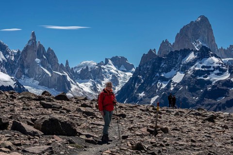 HIking woman, trail to viewpoint Loma del Pliegue Tumbado, mountain range of Cerro Torre and Cerro