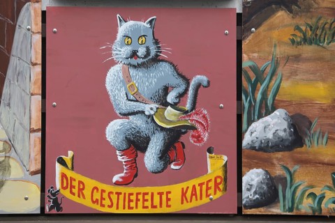 Wall painting around fairy tale Puss in Boots, fairy tale characters, cat figure with boot and hat