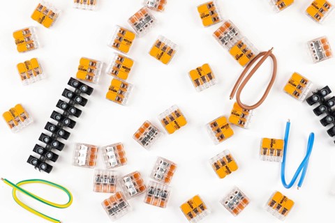 Various connectors and cables scattered on white background