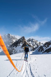 Ski tourer with rope, rope team on the Vadret da Porchabella glacier on the ascent to the summit of