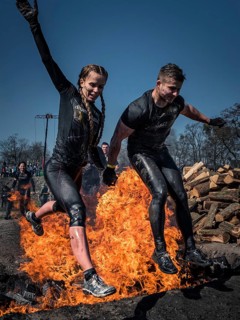 WROCLAW, POLAND - APRIL 7, 2018: Extreme running with obstacle RUNMAGEDDON. In the picture a runner