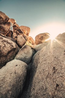 Woman hiking at sunrise in Joshua Tree National Park
