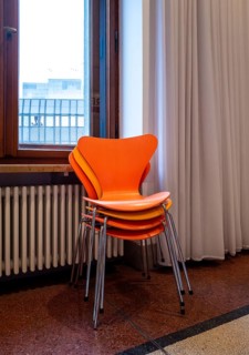 Colourful wooden chairs in the sixties style in a room in the Museum of Communication on Leipziger