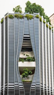 This image captures a unique modern building in Singapore, featuring an architectural design that